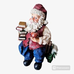 Vintage Santa ceramic figurine with book stack